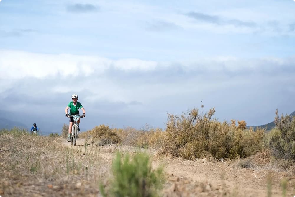 A learner mountain biking on the Lourensford trails