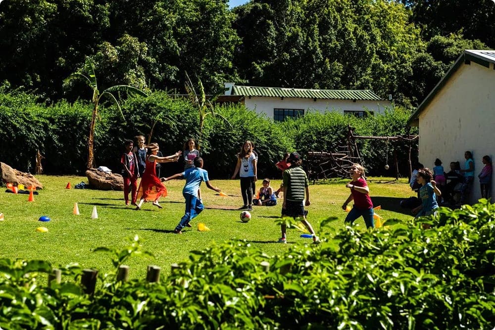 Children playing soccer on school fields